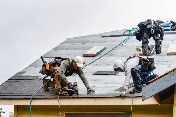 Professional Roofing technician working in Baldwin, NY
